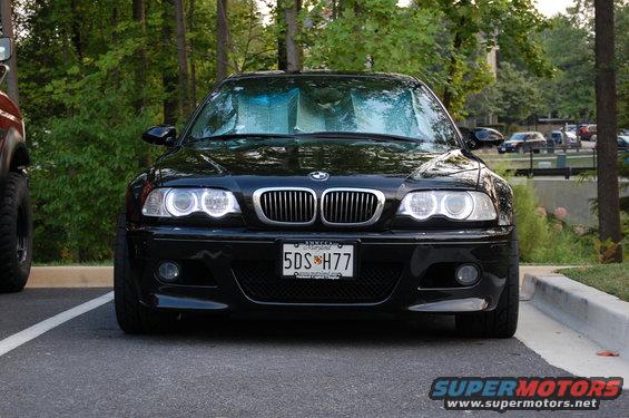Black 2002 BMW M3 front view, parked, with sunshade on windshield