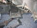 1984 Ford Bronco II - Close-up view of vehicle frame and suspension components, with visible metalwork and a driveshaft.