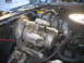 1984 Ford Bronco II - Engine bay components including the AC compressor and air filter are shown in this close-up view.