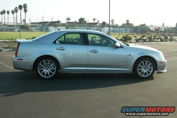 Silver 2006 Cadillac STS sedan, side view, parked on asphalt
