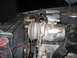 1984 Ford Bronco II - Close-up view of the engine bay, highlighting the air conditioning compressor and related components.