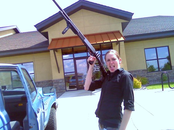 0612091555a.jpg Another picture of Chelsea with my shotgun.