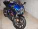 2002 Buell Lightning w/Fairing - Sportbike motorcycle parked indoors, showing front view with blue and black fairings.