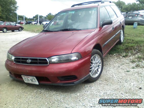 Red 1998 Subaru Legacy wagon, front 3/4 view. License plate 239-NCT