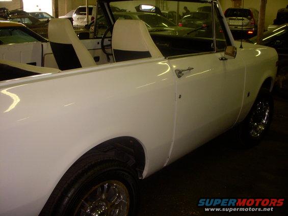 White International Harvester Scout II convertible, side view, showing interior seats and chrome wheels