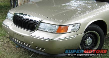 Gold 2000 Mercury Grand Marquis front grille and headlights. Supermotors.net watermark