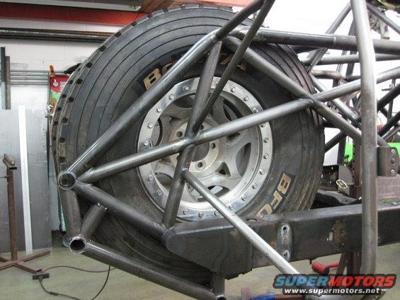 Spare tire mounted within custom roll cage structure