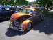 1964 Ford Fairlane - Customized Volkswagen Beetle with luggage rack and open hood displaying a spare tire.