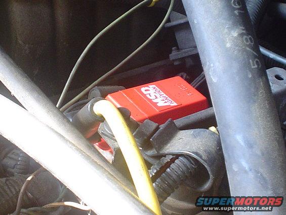 Red MSD ignition box and yellow wire in engine bay