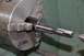 1996 Ford Bronco - A tap is centered in a lathe chuck, ready for machining.