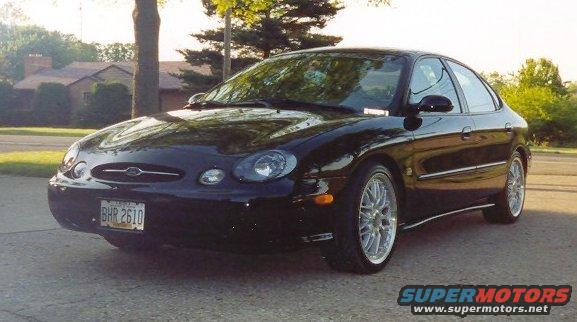 Black 1999 Ford Taurus parked on a driveway