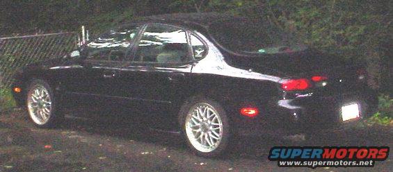 1999 Ford Taurus sedan parked outdoors, rear quarter view