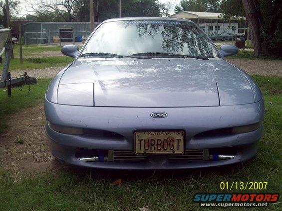 this is a new front shot pic of my car... the new godspeed 3 inchcore intercooler and the new polished aluminum piping really sets this thing off dont you agree?
