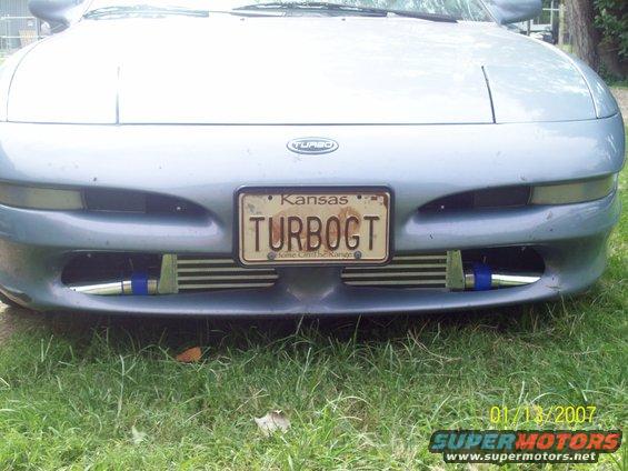 100_1149.jpg here is a close up of the new intercooler and new piping.. as you can see it barely fits... the pics would have came out better but its cloudy out today