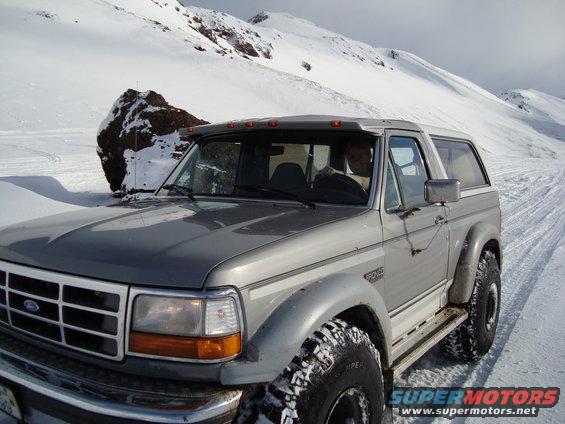 Gray 1992 Ford Bronco in snow, 3q-front view