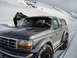1992 Ford Bronco - A 1992 Ford Bronco navigates a snowy mountain road.