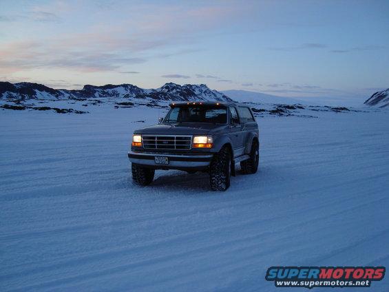 Gray 1992 Ford Bronco parked in a snowy landscape
