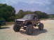 1984 Ford Bronco II - Modified 1984 Ford Bronco II sits on a dirt path with a second truck in the background.