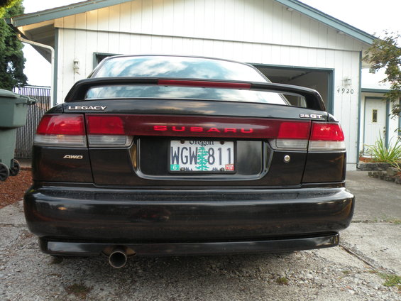 Black 1998 Subaru Legacy 2.5 GT sedan rear view, with spoiler and Oregon license plate WGW 811