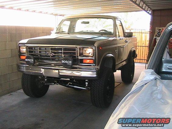 Ford Bronco parked in garage, front view. Has Bosch lights on bumper