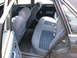 1985 Ford LTD - The interior of a 1985 Ford LTD features blue cloth seats and dark trim.
