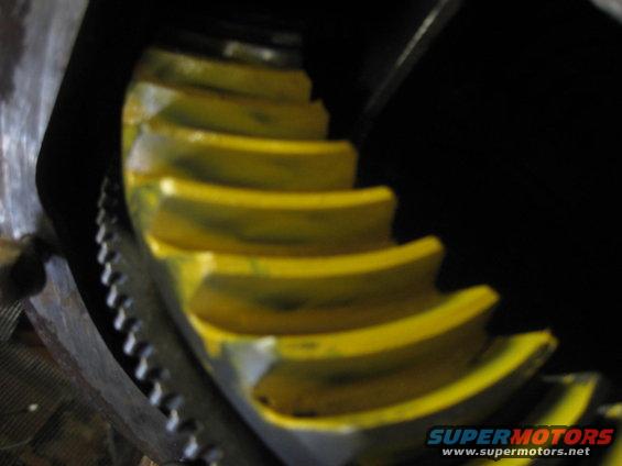Close-up of a differential gear with yellow paint markings