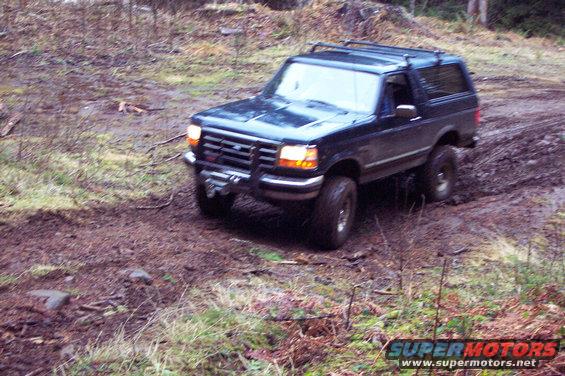 dcp_0101.jpg Chris in his 95 entering an unmarked trail.  About half way up this trail Chris got hung up on one 

of the stumps in the middle of the trail and got to use his winch.