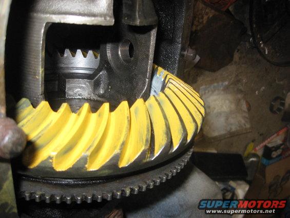 Close-up of differential gears with yellow marking compound applied