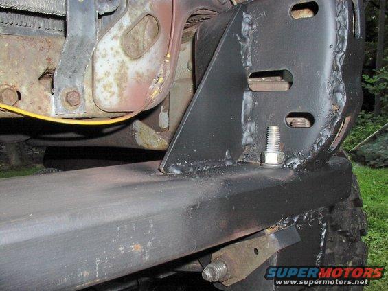 Close-up of a custom bumper mount with bolts and welds
