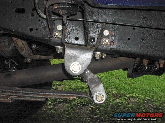 Close-up of vehicle suspension components and leaf springs