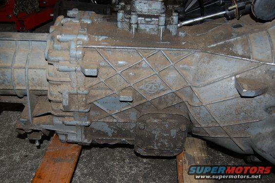 Gray transmission with ZF logo, supported by wooden blocks