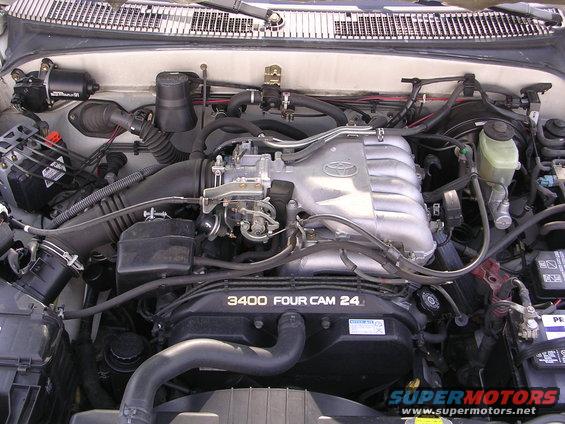 Engine bay with a Toyota V6 engine, showing intake manifold and valve cover