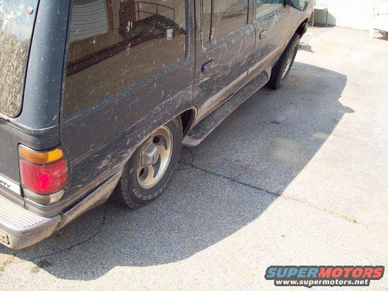 1997 Mercury Mountaineer side view, dark color, running boards