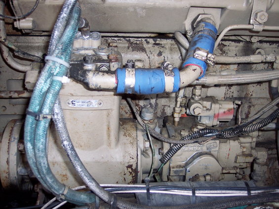 close-up of engine parts, hoses, and wiring