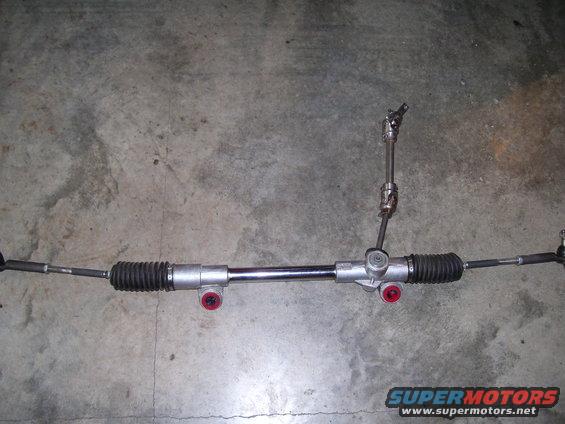 steering rack and pinion assembly with tie rods and bellows
