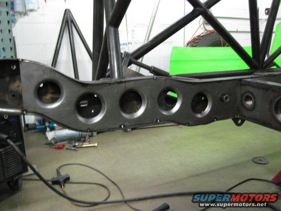 Custom roll cage and frame with circular cutouts