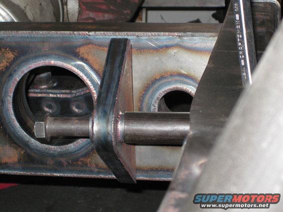Close-up of custom steel bracket with a bolt passing through it