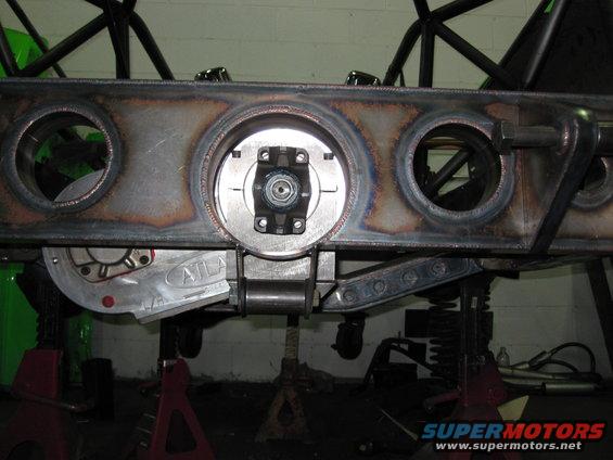 Custom differential housing with 'ATLAS' visible, mounted on jack stands