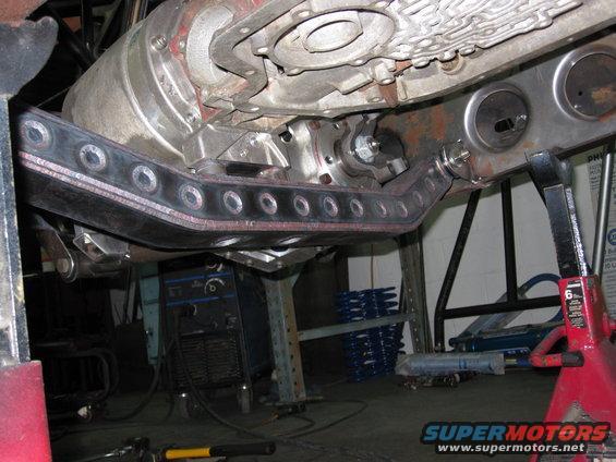 Vehicle underbody showing transmission, transfer case, and a custom skid plate
