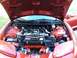 2001 Pontiac Trans Am - The engine bay of a 2001 Pontiac Trans Am is visible with the hood raised, revealing the motor and surrounding components.