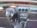 2001 Pontiac Trans Am - The interior of a 2001 Pontiac Trans Am features a dashboard with gauges, a steering wheel, and a center console with a gear shifter.