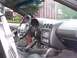 2001 Pontiac Trans Am - The interior of a car is shown, focusing on the dashboard and driver's side controls.
