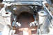1964 Ford Fairlane - The engine bay of a 1964 Ford Fairlane shows signs of rust and is missing its engine.