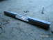 1984 Chevrolet Blazer - A custom metal bumper is shown on a gravel surface, with tools visible in the background.