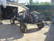 1983 Volkswagen Beetle - Custom off-road buggy with a prominent roll cage and large tires is parked in a driveway.