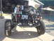 1983 Volkswagen Beetle - This custom off-road buggy is viewed from the rear, showing its exposed mechanical components and roll cage.