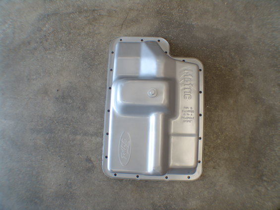 Ford transmission pan with 'Metric' stamped on the side