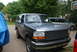1995 Ford Bronco - This 1995 Ford Bronco is seen in a driveway with a silver minivan in the background.