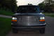 1995 Ford Bronco - Front view of a dark gray 1995 Ford Bronco, its chrome grille.