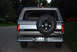 1995 Ford Bronco - Rear view of a 1995 Ford Bronco, showing its spare tire and distinctive body style.